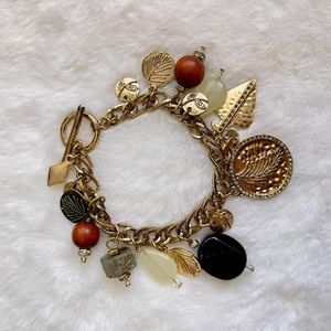 Charms bracelet with precious stones.